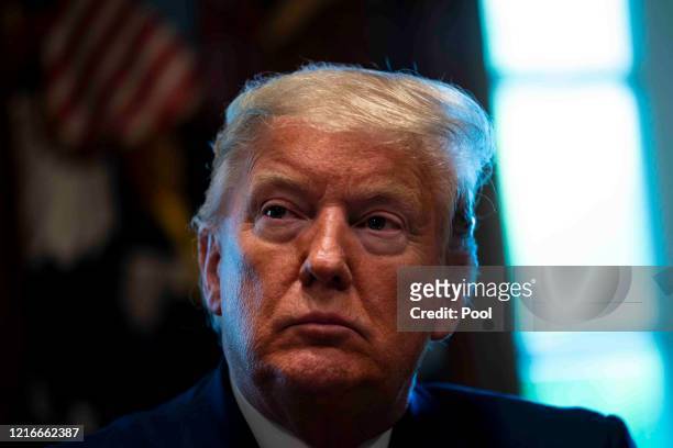 President Donald Trump listens during a roundtable meeting with energy sector CEOs in the Cabinet Room of the White House April 3, 2020 in...