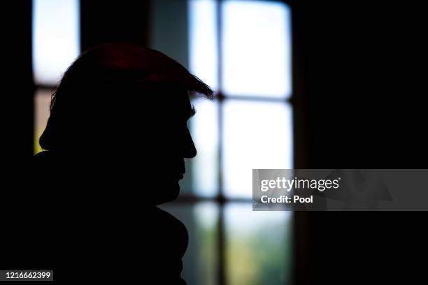 President Donald Trump listens during a roundtable meeting with energy sector CEOs in the Cabinet Room of the White House April 3, 2020 in...