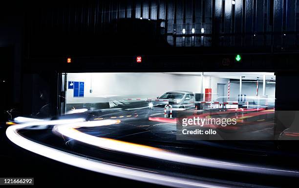 parking garage's exit - blurred motion - car park barrier stock pictures, royalty-free photos & images