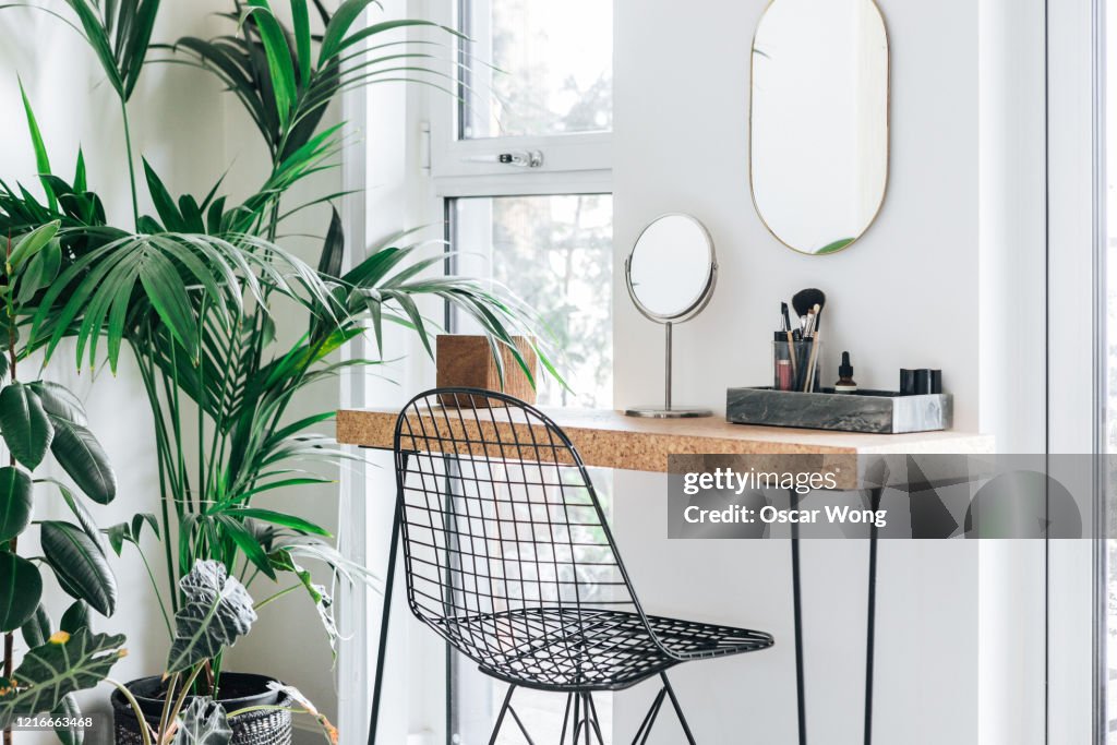 A corner of the modern, stylish and bright bedroom with plants