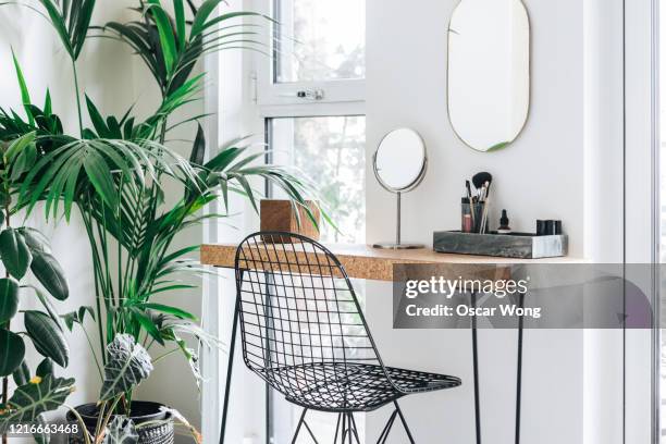 a corner of the modern, stylish and bright bedroom with plants - dressing table stock pictures, royalty-free photos & images