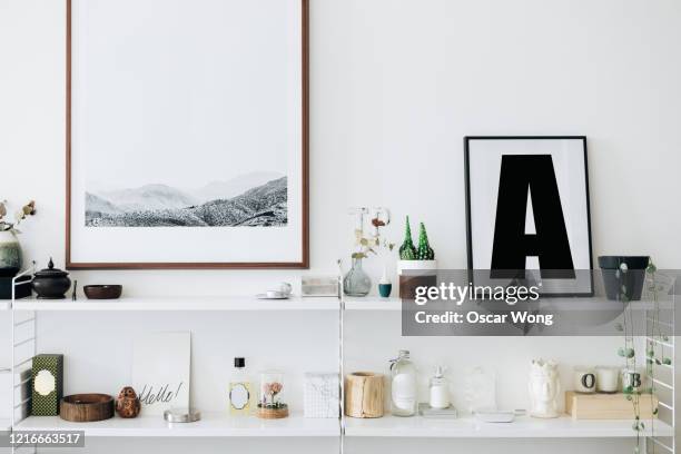 a well decorated and stylish shelving unit - continental_shelf stock pictures, royalty-free photos & images