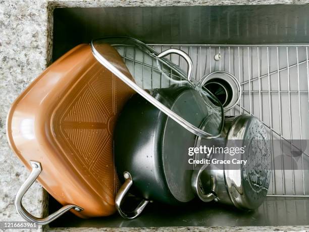 pots drying off in kitchen sink - wash the dishes stock pictures, royalty-free photos & images