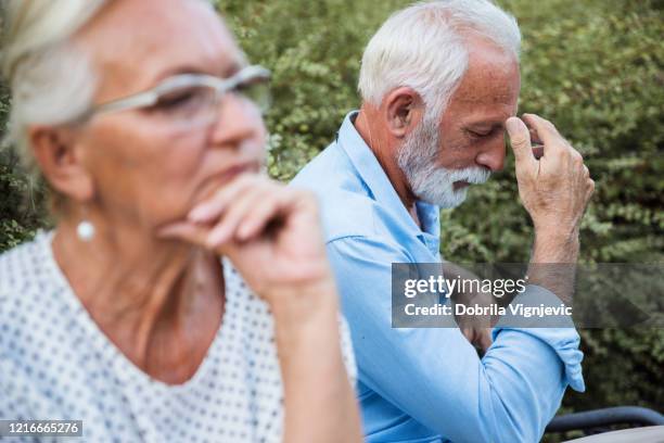 angry mature couple avoiding looking at each other - avoiding conflict stock pictures, royalty-free photos & images