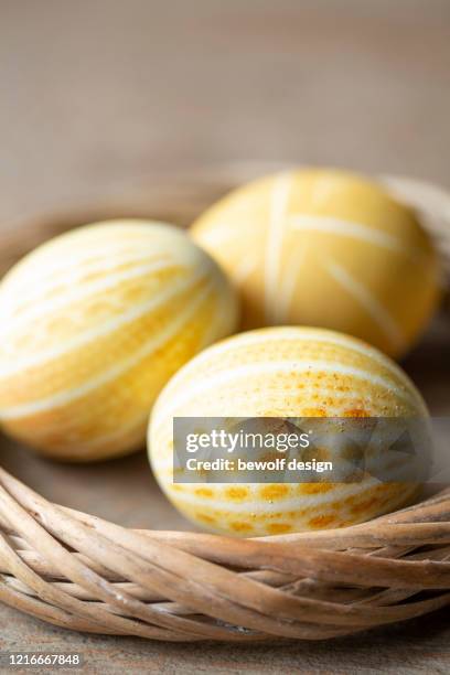 yellow egg with patterns - kurkuma ストックフォトと画像