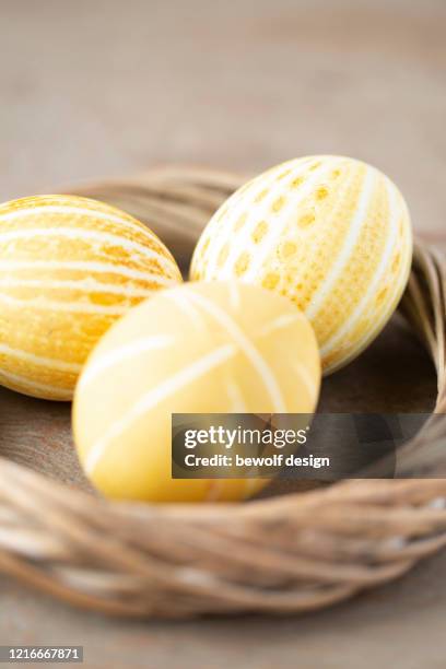 yellow egg with patterns - kurkuma ストックフォトと画像