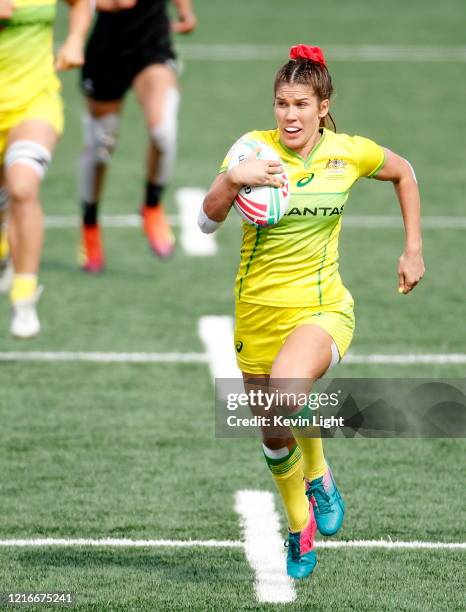 Charlotte Caslick of Australia runs with the ball against New Zealand during the HSBC World Rugby Sevens Series Gold medal match at Westhills Stadium...
