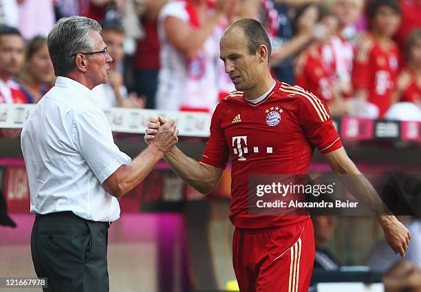 Arjen Robben of Bayern Muenchen is exchanged by team coach Jupp Heynckes during the Bundesliga match between FC Bayern Muenchen and Hamburger SV at...