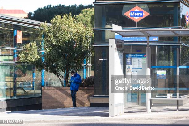 Madrid Metro worker is seen wearing a mask at the subway door on April 03, 2020 in Madrid, Spain. Spain ordered all non-essential workers to stay...