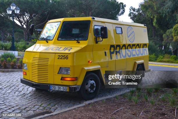 bank armored van on a street - armoured truck stock pictures, royalty-free photos & images