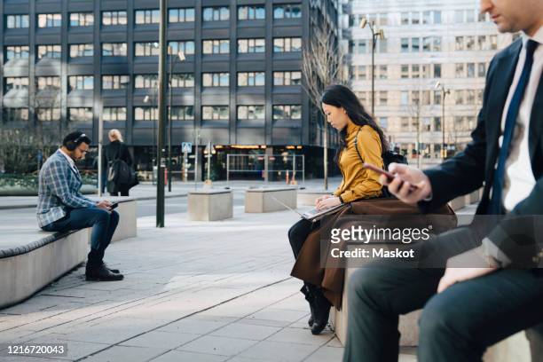 business people working outside keeping distance - big tech foto e immagini stock