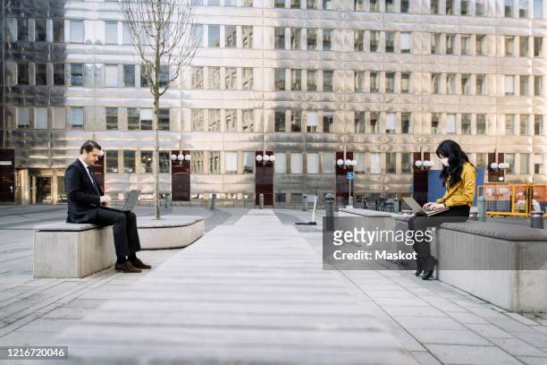 business people keeping distance working outdoors - social distancing work stock pictures, royalty-free photos & images