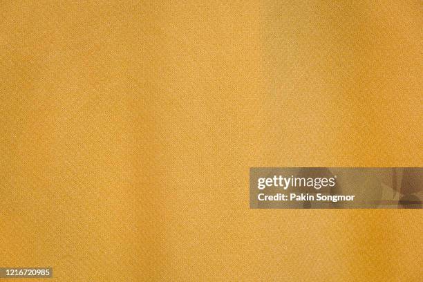 yellow fabric cloth texture background. - table cloth stockfoto's en -beelden