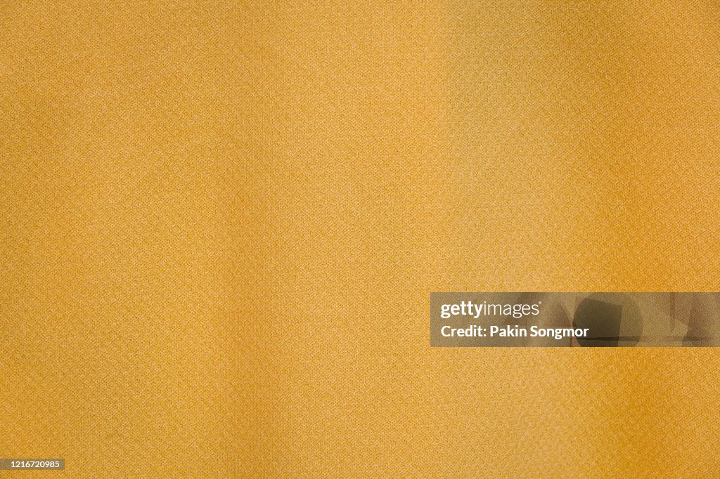 Yellow fabric cloth texture background.