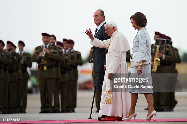 Pope Benedict XVI waves to the crowd surrounded by Queen Sofia and King Juan Carlos at the end of his visit to Spain for leading The World Youth Day...