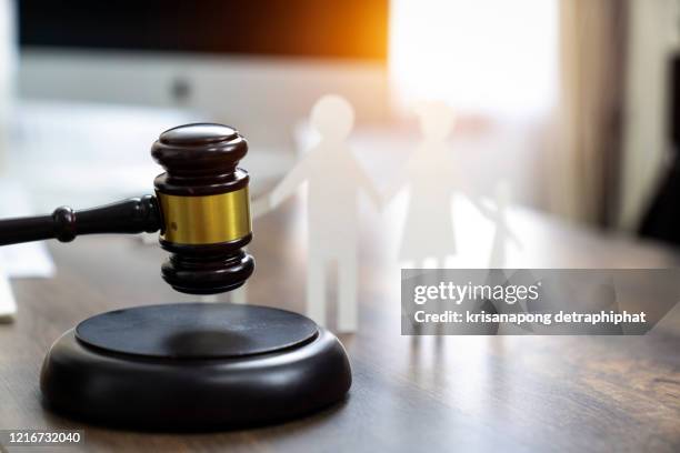 black judges gavel and family figure made in paper on office desk. law concept,insurance - divorce lawyer stock pictures, royalty-free photos & images