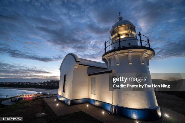 lighthouse at dusk with ground lights illuminated - port macquarie stock pictures, royalty-free photos & images