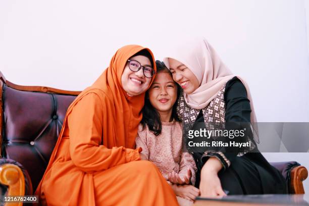 beautiful indonesian family celebrate ramadan together - indonesia family stock pictures, royalty-free photos & images