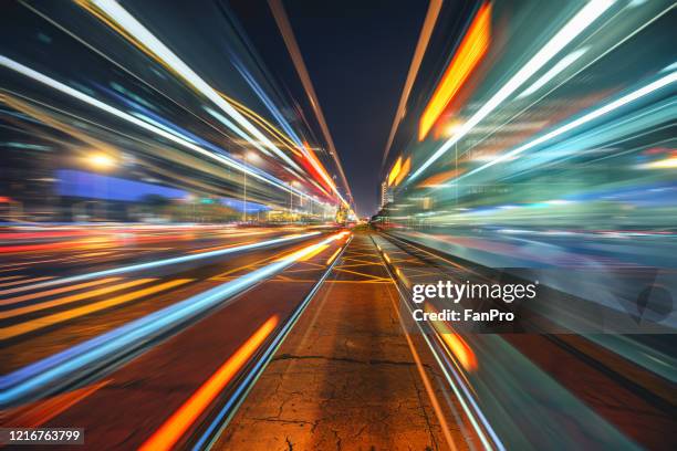 urban night view and high speed traffic - light car night stock-fotos und bilder