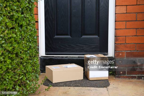 selection of parcels in cardboard boxes - supermarket delivery stock pictures, royalty-free photos & images