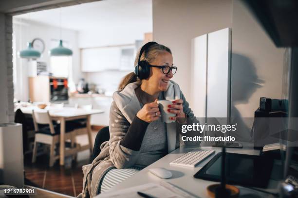 working from home during corona lockdown - pajamas work stock pictures, royalty-free photos & images