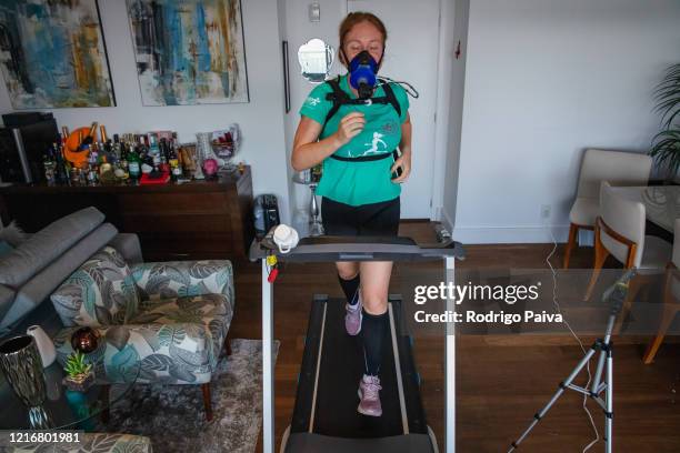 Digital influencer Caca Filippini trains at her home on March 31 in Sao Paulo, Brazil. Caca started training in late 2019 to run the NY marathon,...