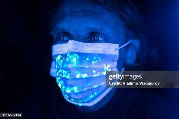 man wearing protective face mask - uv light stock pictures, royalty-free photos & images