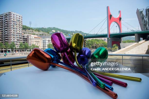 Artist Jeff Koons' artwork "Tulips" is pictured at the Guggenheim Bilbao Museum after its reopening in the Spanish Basque city of Bilbao on June 1,...