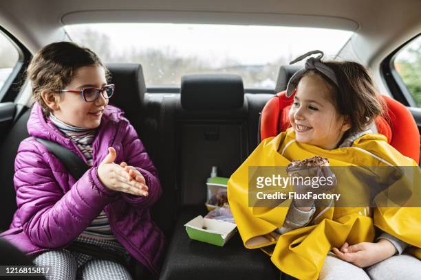 sharing is caring - purple jacket stock pictures, royalty-free photos & images