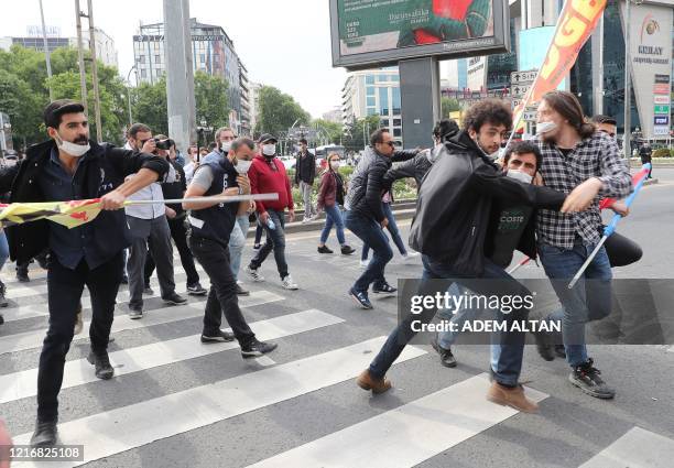 Protesters run from police during a gathering in memory of Ethem Sarisuluk, a 26-year old Turkish man killed by a riot police officer in June 2013...