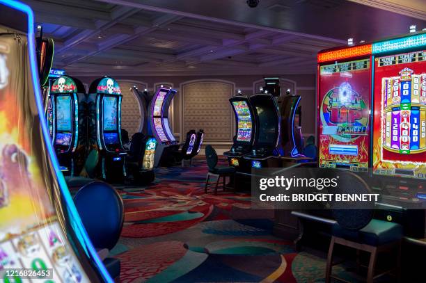 Chairs are seen removed from some gaming machines to provide more distancing during a media tour of Bellagio hotel and casino reopening in Las Vegas,...