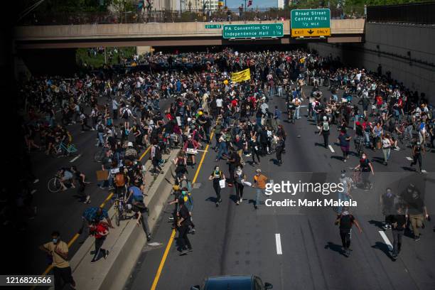 Protesters away from tear gas after a march through Center City on June 1, 2020 in Philadelphia, Pennsylvania. Demonstrations have erupted all across...