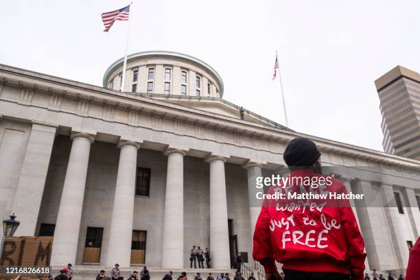 Protesters sit-in on the front lawn of the Ohio Statehouse during an afternoon of peaceful demonstrations on June 1, 2020 in Columbus, Ohio....