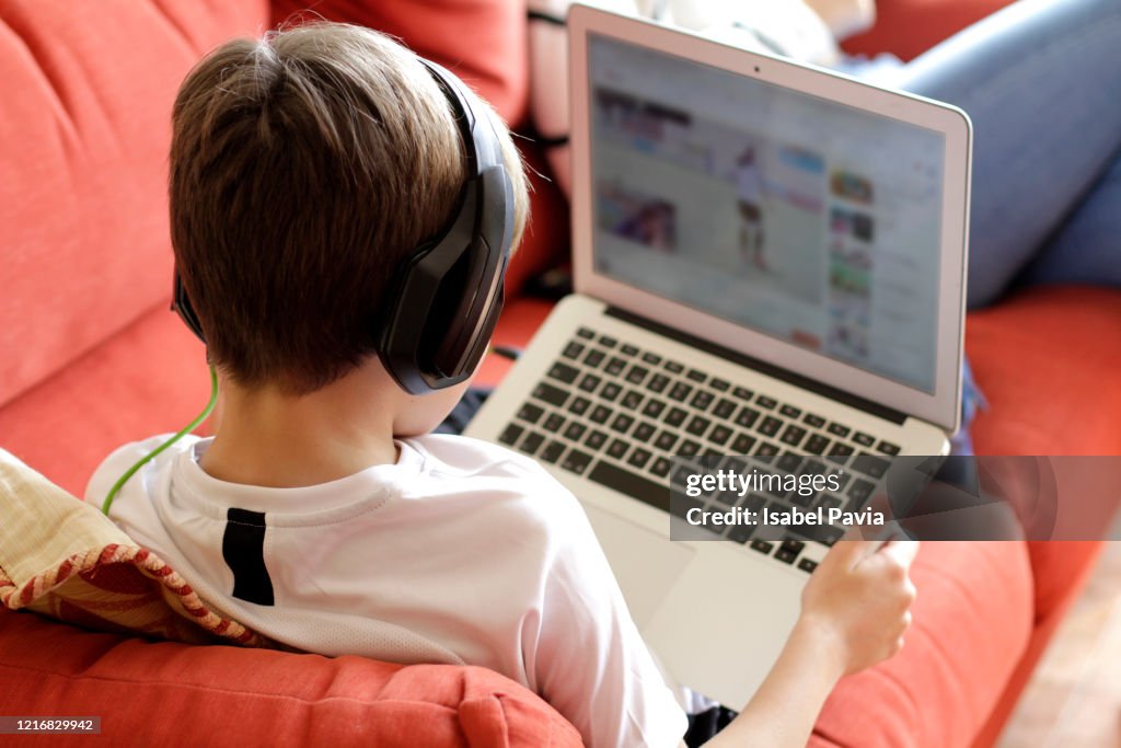 Boy Playing Video Game On Computer