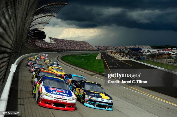 Mark Martin, driver of the Carquest/GoDaddy.com Chevrolet, and Greg Biffle, driver of the Pure Michigan Ford, lead the field during the NASCAR Sprint...