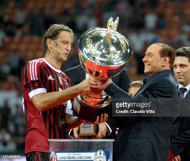 Milan chairman Silvio Berlusconi and Massimo Ambrosini celebrate after winning the Berlusconi Trophy during the Berlusconi Trophy match between AC...