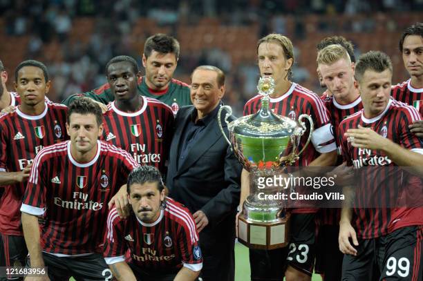 Tha players of AC Milan and AC Milan chairman Silvio Berlusconi celebrate after winning the Berlusconi Trophy during the Berlusconi Trophy match...