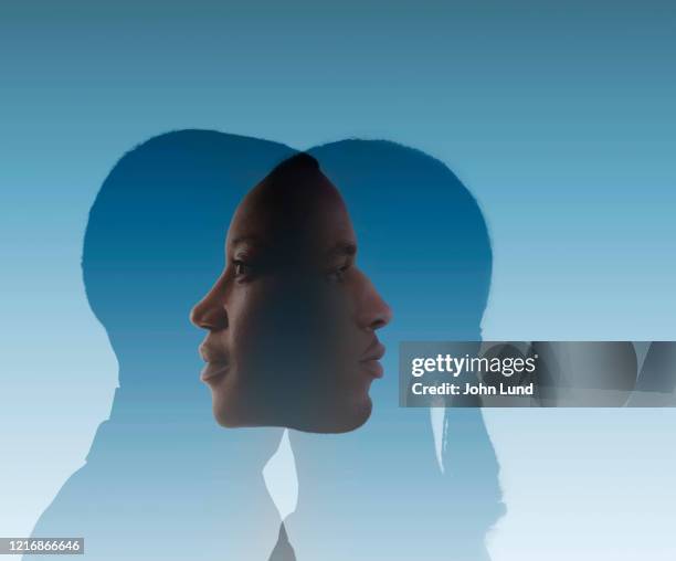 introspective merging couple - two face stock pictures, royalty-free photos & images