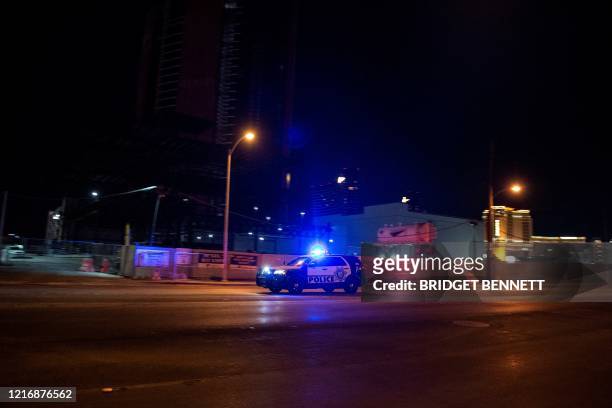 Police car makes its way to the scene after a shooting was reported outside Circus Circus hotel and casino, on June 1 in downtown Las Vegas, at the...