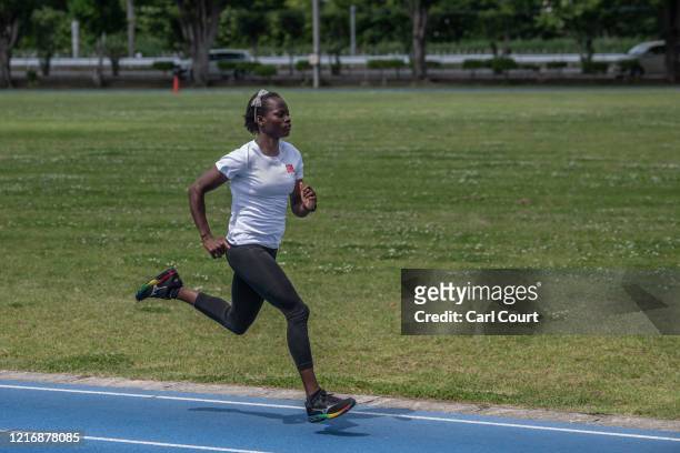 Year-old South Sudanese 100m and 200m Olympic sprinter, Moris Lucia, trains at an athletics track on June 2, 2020 in Maebashi, Gunma, Japan. The four...