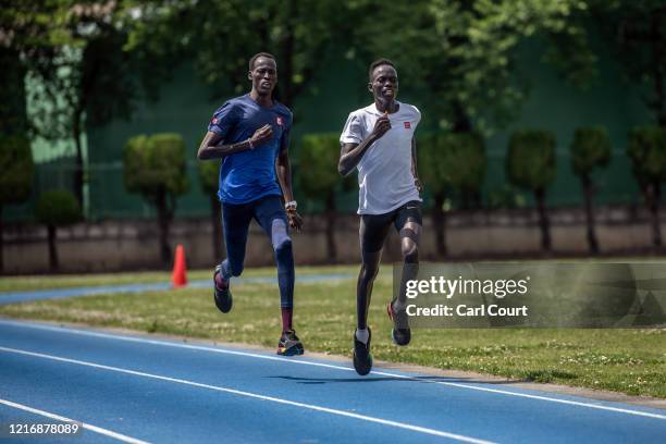 South Sudanese Olympians Abraham Majok Matet Guem and Joseph Akoon Akoon train at an athletics track on June 2, 2020 in Maebashi, Gunma, Japan. The...