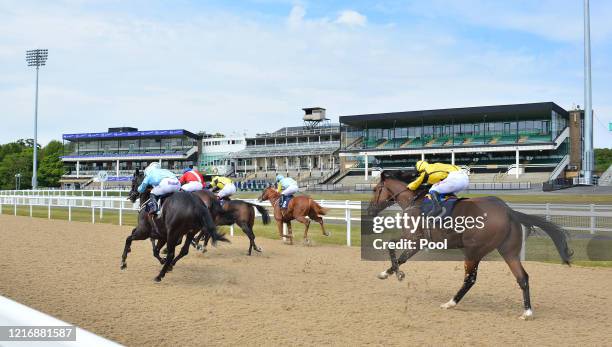 General view as Canagat and jockey Hollie Doyle approach the finish line to win the Betway Casino Handicap race at Newcastle Racecourse on June 02,...