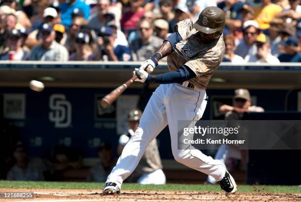 Orlando Hudson of the San Diego Padres hits the ball for a single in the first inning of the game against the Florida Marlins at Petco Park on August...