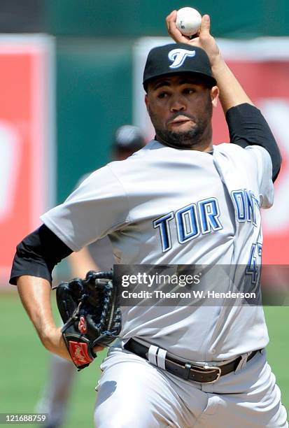 Luis Perez of the Toronto Blue Jays pitches against the Oakland Athletics in the third inning during an MLB baseball game August 21, 2011 at the O.co...