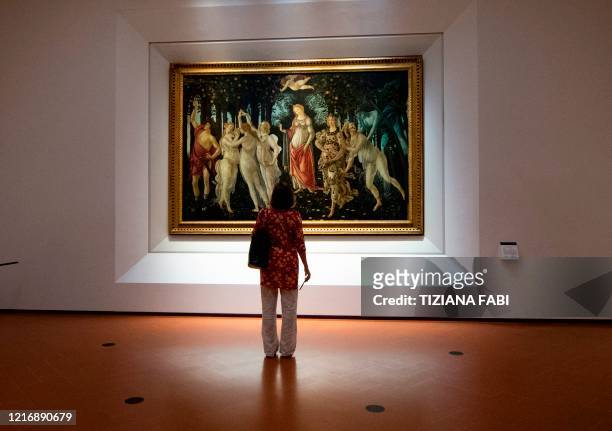 Journalist views Sandro Botticelli's "Primavera" at the Uffizi Gallery Museum in Florence on June 2 during a press preview on the eve of its...