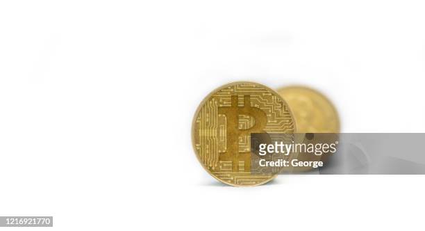 close-up of bitcoins on white background - bitcoin stock pictures, royalty-free photos & images