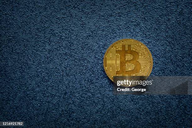bitcoin on dark background - bitcoin stock pictures, royalty-free photos & images