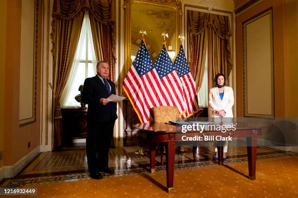 Speaker of the House Nancy Pelosi, D-Calif., and Rep. Chris Smith, R-N.J., hold a bill enrollment photo opportunity for the Uyghur Human Rights...