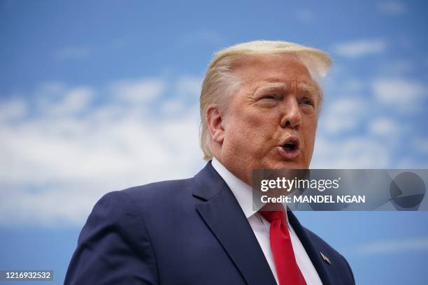 President Donald Trump speaks to the press before boarding Air Force One as he departs from Joint Base Andrews in Maryland on May 30, 2020. - Trump...