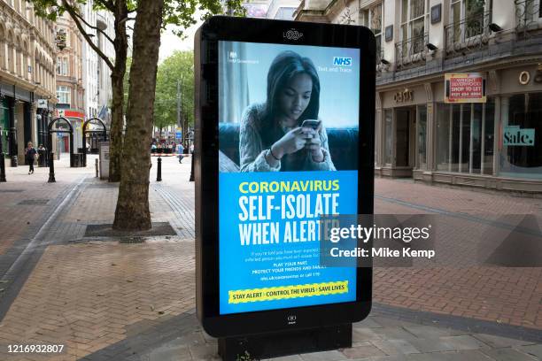 Government, Public Health England, NHS advertising boards test and trace advice to self isolate for 14 days if alerted as the Coronavirus lockdown...